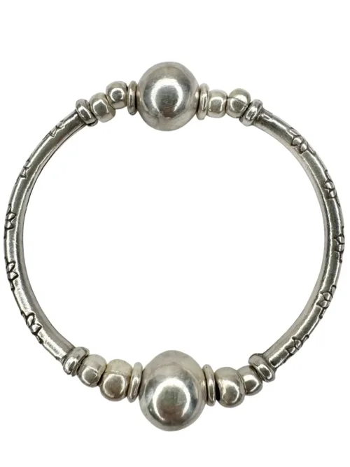 pure silver curve bar stretch bracelet with 2 silver balls. perfect for everyday wear and bracelet stacking. ocean safe