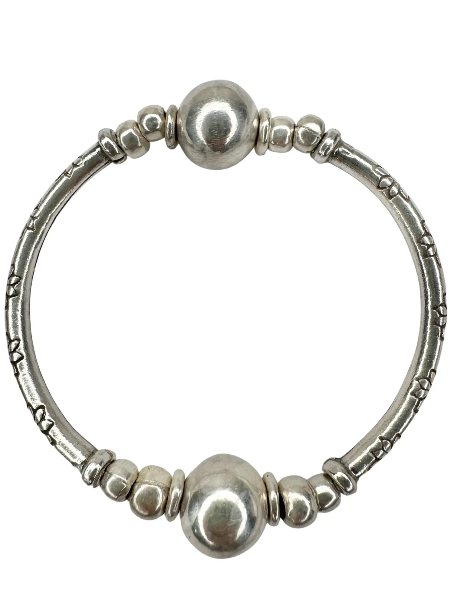 pure silver curve bar stretch bracelet with 2 silver balls. perfect for everyday wear and bracelet stacking. ocean safe