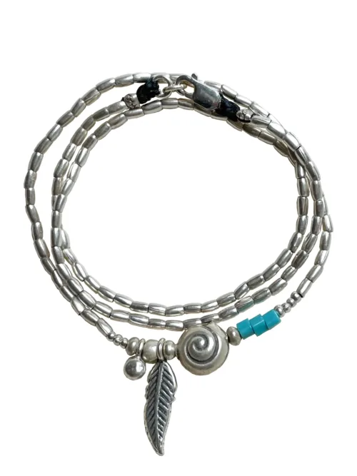 ocean inspired silver jewellery. Pure silver wrap bracelet with spiral shell for a beach vibes look- water safe for everyday wear. 3 styles in 1
