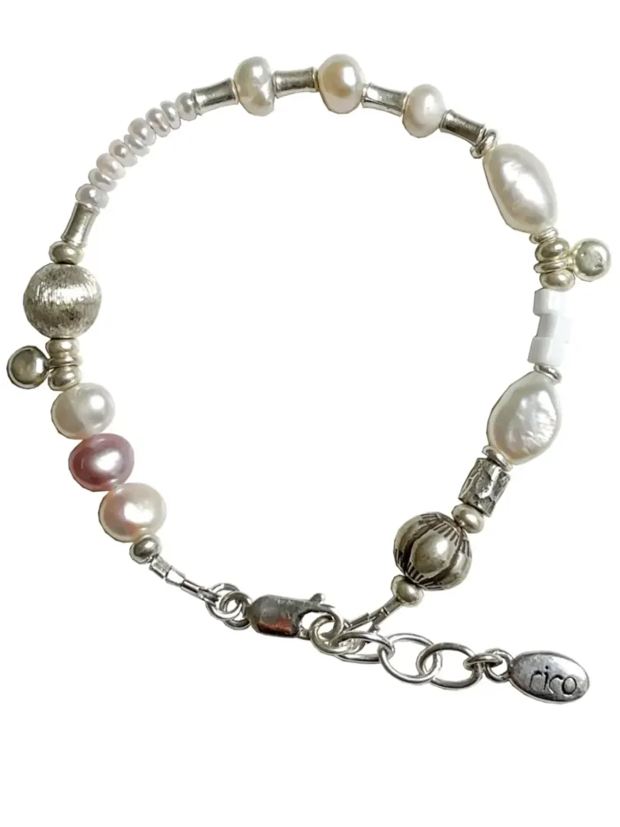freshwater pearl silver bracelet with lots of charms.