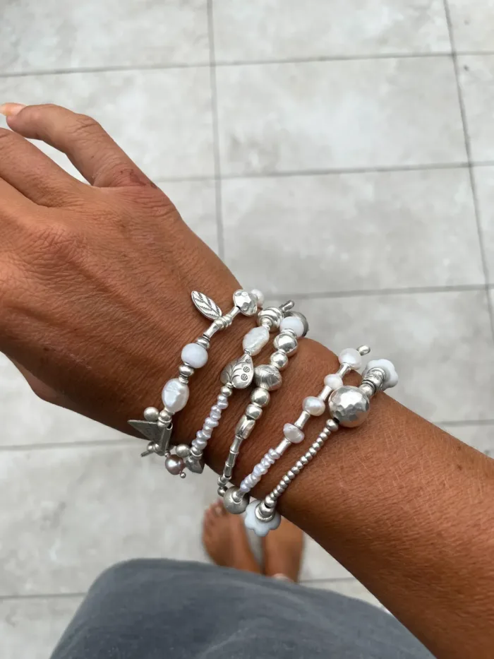 freshwater pearl silver bracelet with lots of charms.pearl bracelet stack