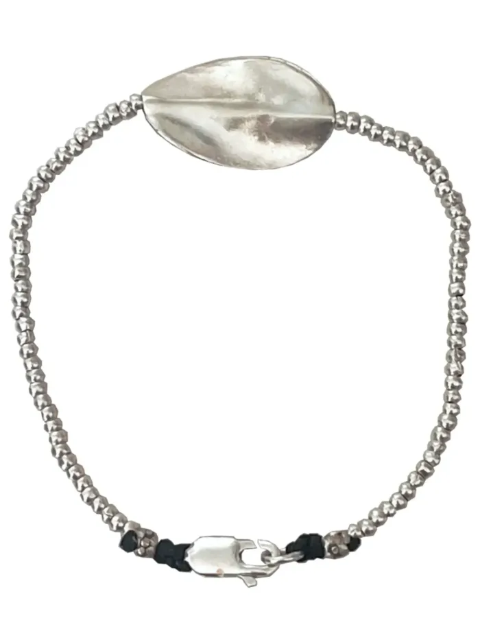 pure silver bracelet with warped disc. tug proof - perfect for active mums. ocean safe