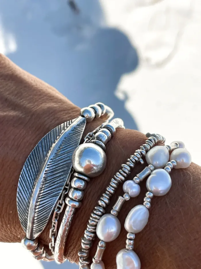 chunky pure silver bracelet perfect for stacking. large curve leaf for bohemian style. easy to slip on stretch elastic