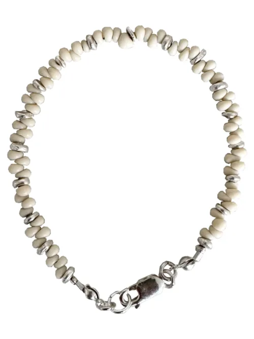 Handmade pure silver bracelet featuring coconut colour seed beads – a great minimal bracelet to add texture and style to your bracelet stack