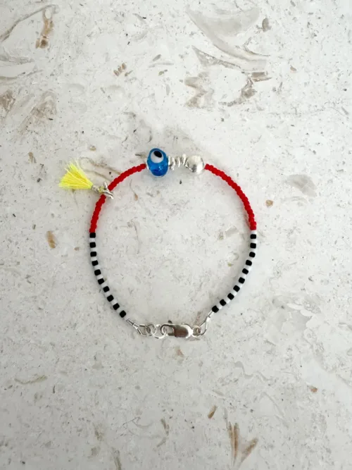 Handmade pure silver bracelet featuring colourful seed beads and an evil eye – a great minimal bracelet to add to your bracelet stack