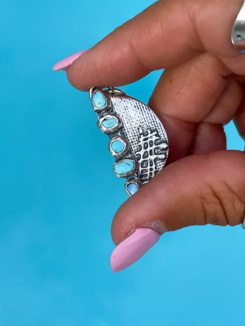 handmade sterling silver crescent pendant with natural golden hill turquoise gemstones. Comes on a sterling silver chain. Please select length. Made by Rico Designs in Sydney Australia