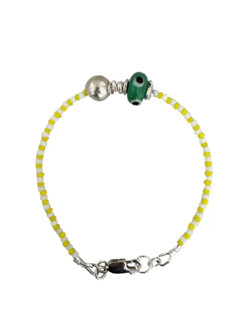 Handmade pure silver bracelet featuring colourful seed beads and an evil eye – a great minimal bracelet to add to your bracelet stack
