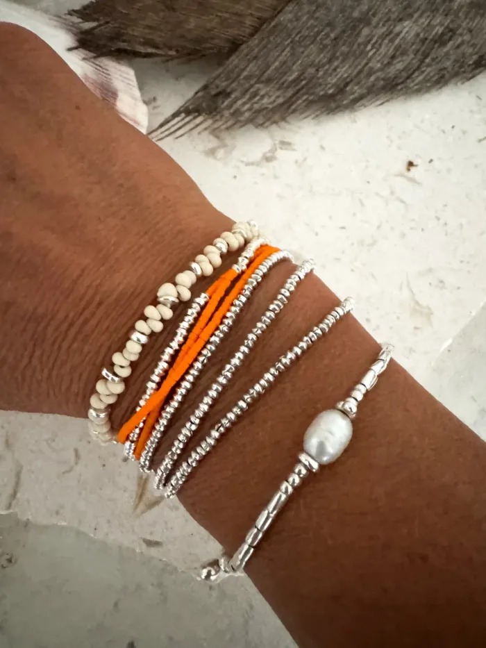 Handmade pure silver wrap bracelet featuring a bright summer colour seed bead of your choice – a great minimal wrap bracelet style for everyday wear