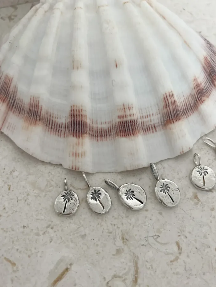 handmade sterling silver necklace with hand stamped palm tree pendant for a beach inspired everyday minimal style necklace.