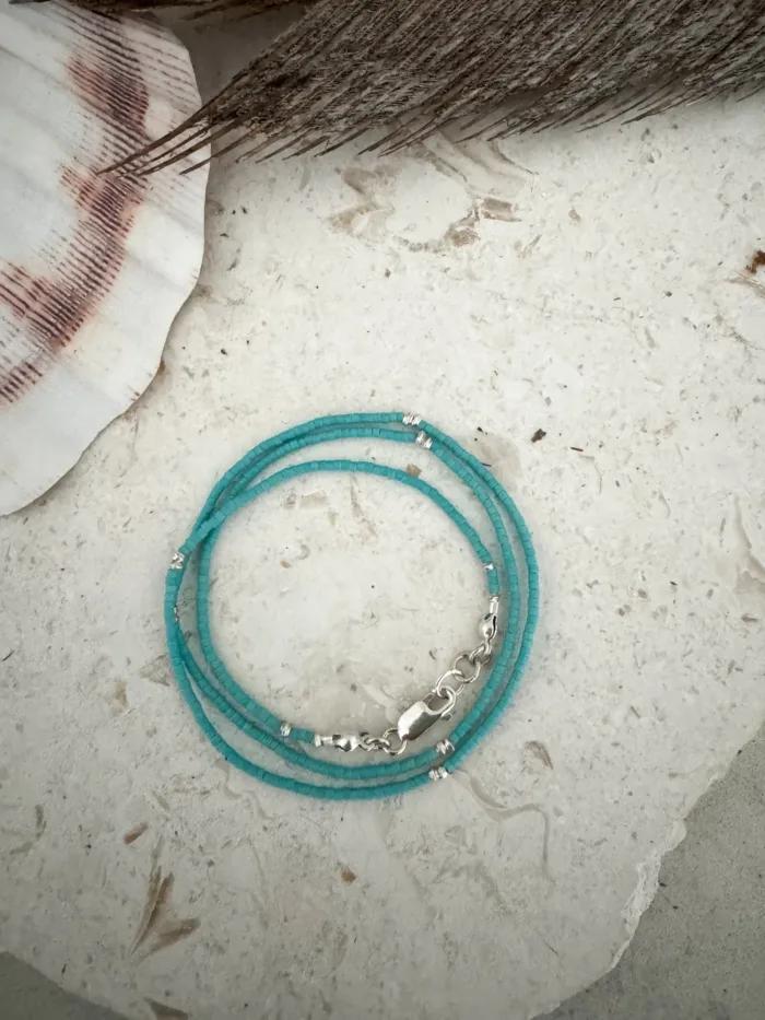 Handmade pure silver wrap bracelet featuring a bright summer colour seed bead of your choice – a great minimal wrap bracelet style for everyday wear