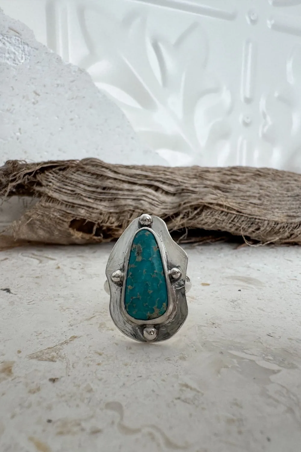 hand cut organic sterling silver ring with natural turquoise gemstone.