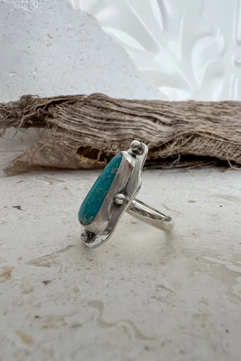 hand cut organic sterling silver ring with natural turquoise gemstone.