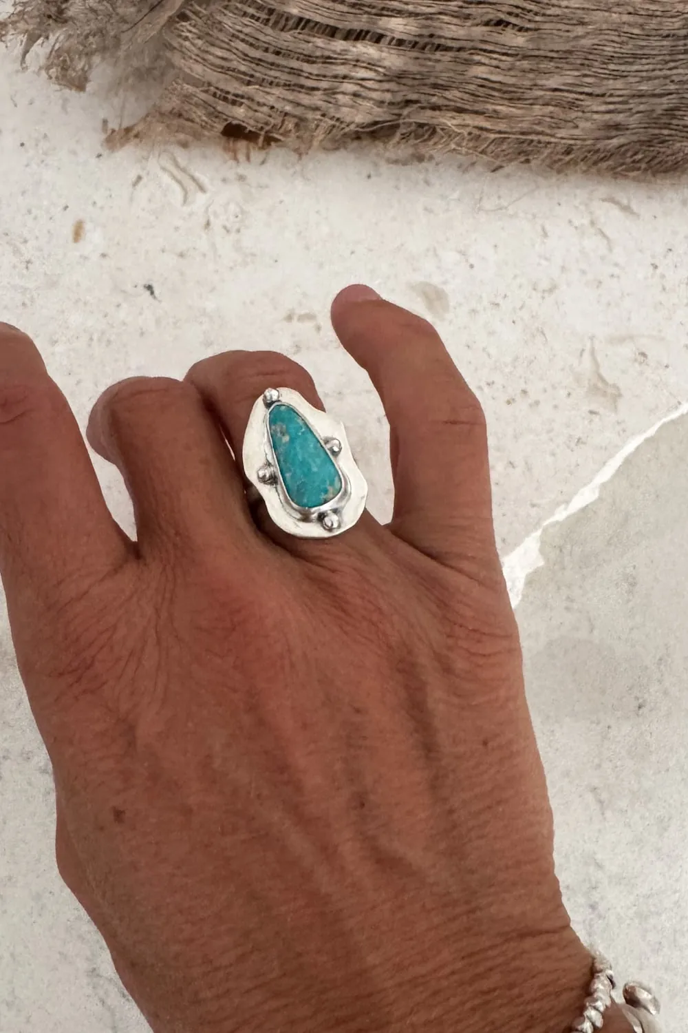 hand cut organic sterling silver ring with natural turquoise gemstone.