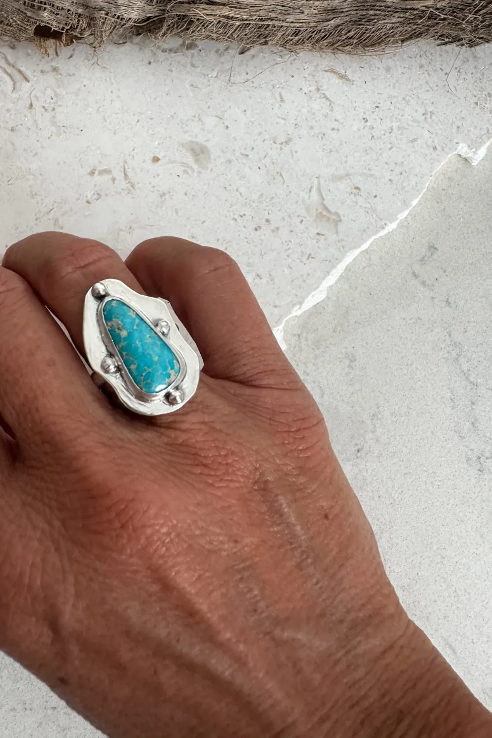 hand cut organic sterling silver ring with natural turquoise gemstone.