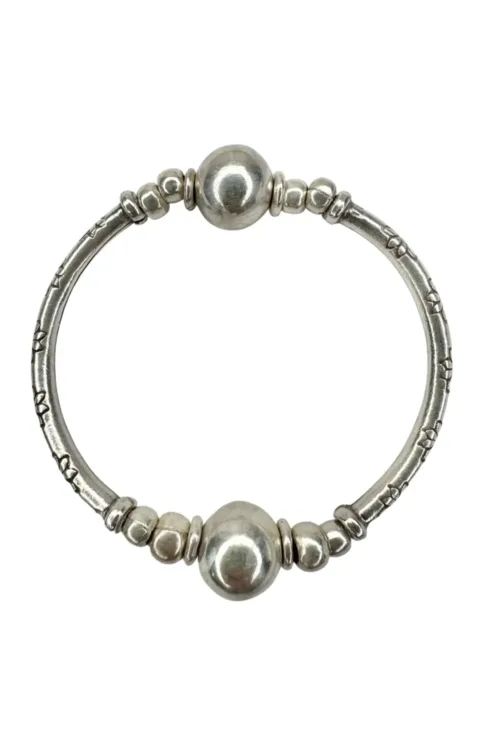 pure silver curve bar stretch bracelet with 2 silver balls. perfect for everyday wear and bracelet stacking. ocean safe