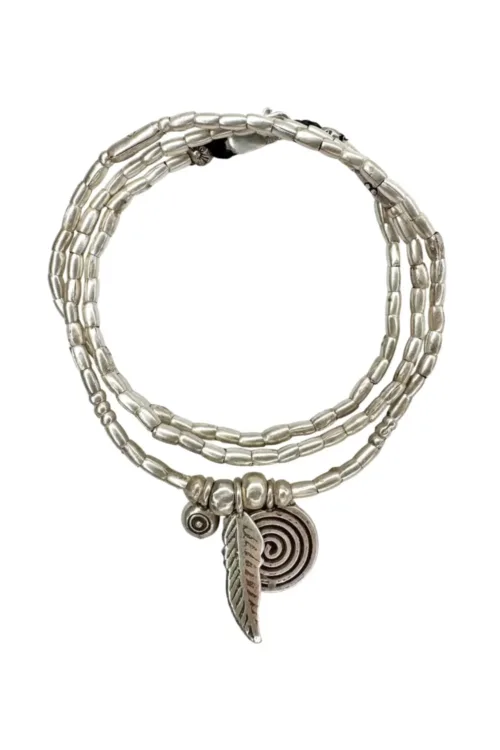 bohemian style silver jewellery. Pure silver wrap bracelet with silver spiral char, feather charm and eye protection charm - for a boho beach chic look- water safe for everyday wear. 3 styles in 1
