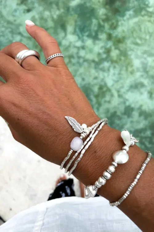ocean inspired silver jewellery. Pure silver wrap bracelet with silver feather charm and kunzite gemstone - for a beach vibes look- water safe for everyday wear. 3 styles in 1