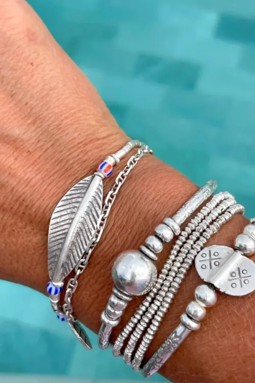 large curve leaf silver bracelet with striped chevron bead. water safe