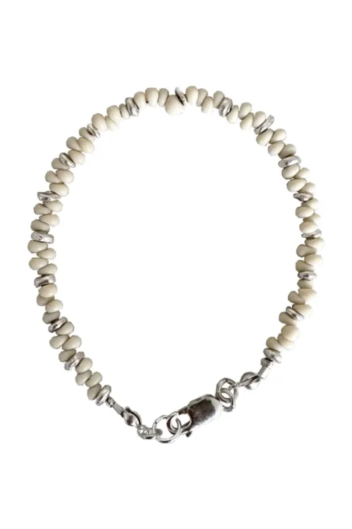 Handmade pure silver bracelet featuring coconut colour seed beads – a great minimal bracelet to add texture and style to your bracelet stack