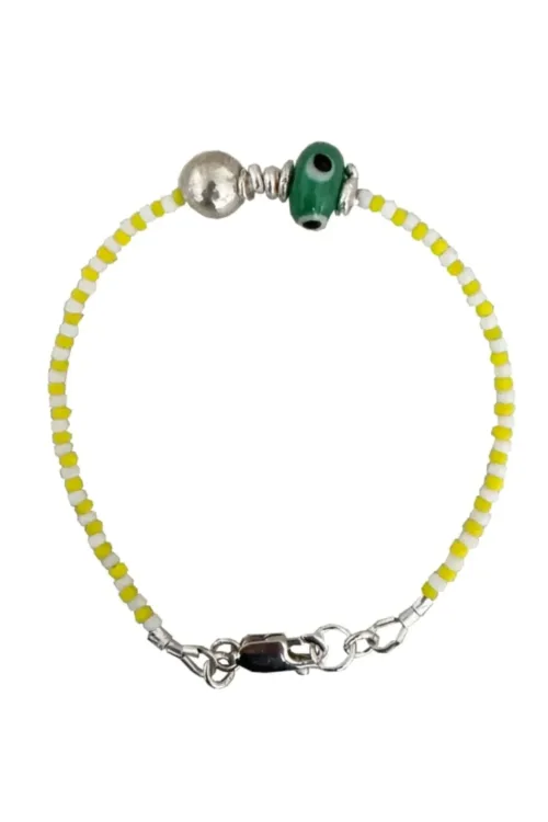 Handmade pure silver bracelet featuring colourful seed beads and an evil eye – a great minimal bracelet to add to your bracelet stack