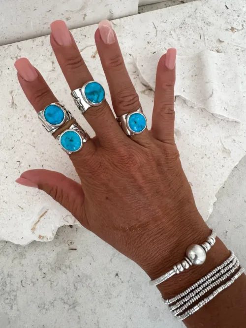 handmade chunky turquoise ring set in sterling silver with hand cut palm trees and waves ocean safe beach inspired