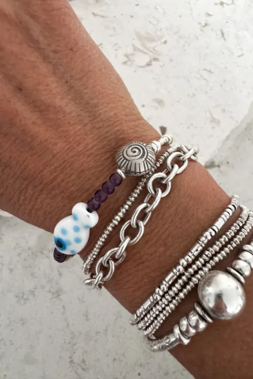 ocean inspired silver bracelet with white glass fish