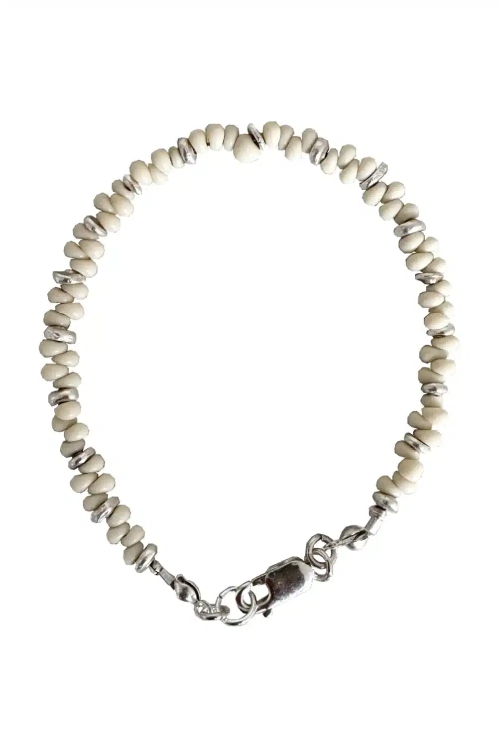 Handmade pure silver bracelet featuring coconut colour seed beads – a great minimal bracelet to add texture and style to your bracelet stack