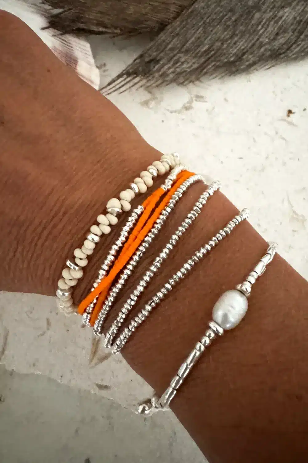 Handmade pure silver wrap bracelet featuring a bright summer colour seed bead of your choice – a great minimal wrap bracelet style for everyday wear