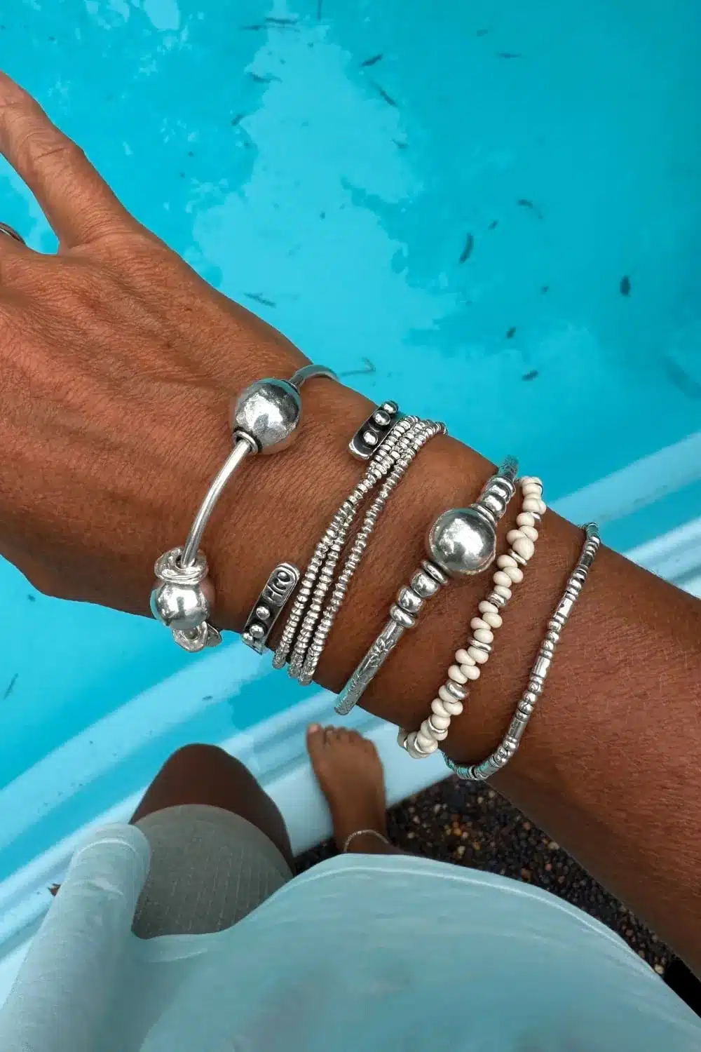 sterling silver bangle with pure silver ball beads and shell charm tassel. Handmade and ocean inspired. ocean safe and perfect to wear everyday