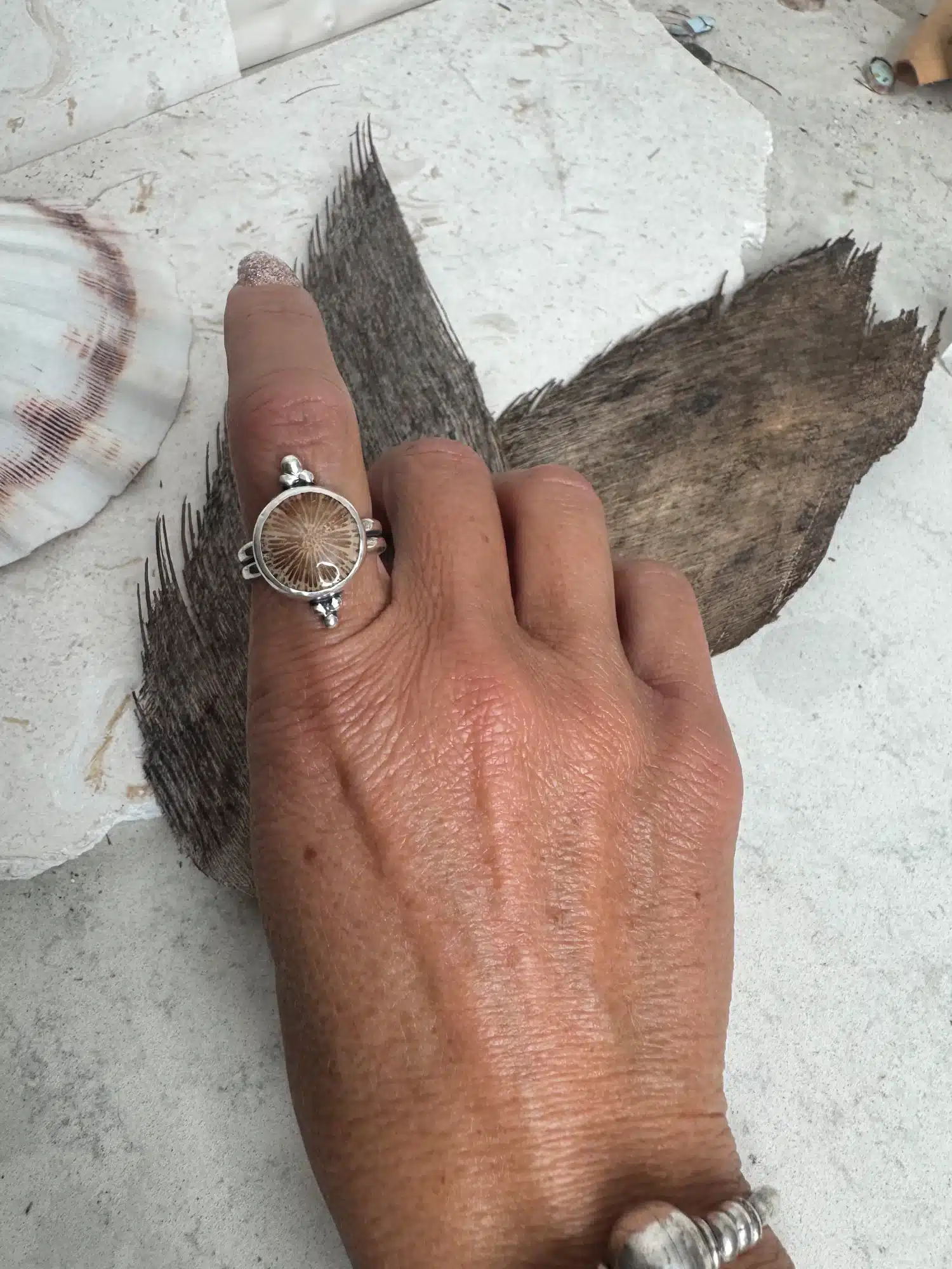 handmade sterling silver fossilised coral ring. inspired by the ocean. Unique jewellery