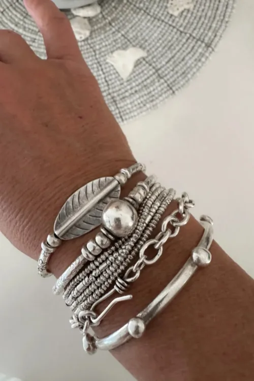 2 looks 1 bracelet. large silver leaf curve bar pure silver bracelet. Strong stretch to easily slip on. Ocean safe and looks great in a bracelet stack