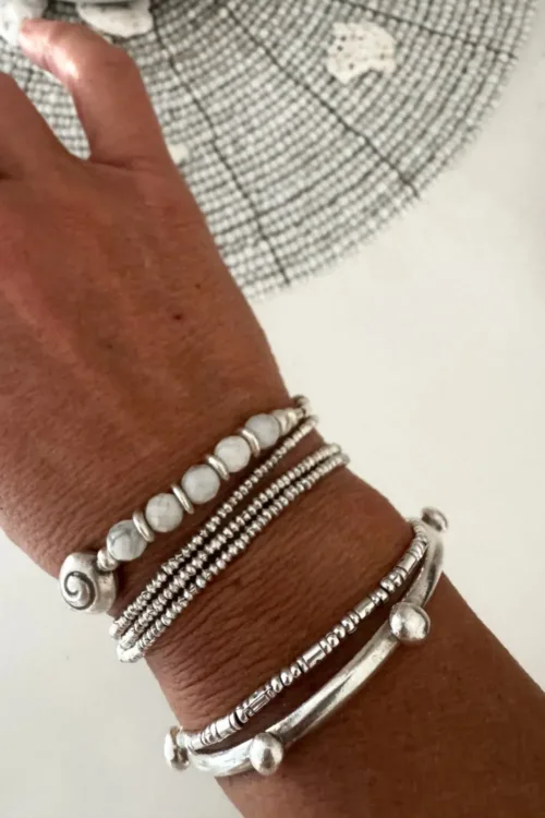 beach inspired pure silver bracelet with spiral silver shell and faceted white agate gemstones. Looks great worn solo or in a bracelet stack. Ocean safe