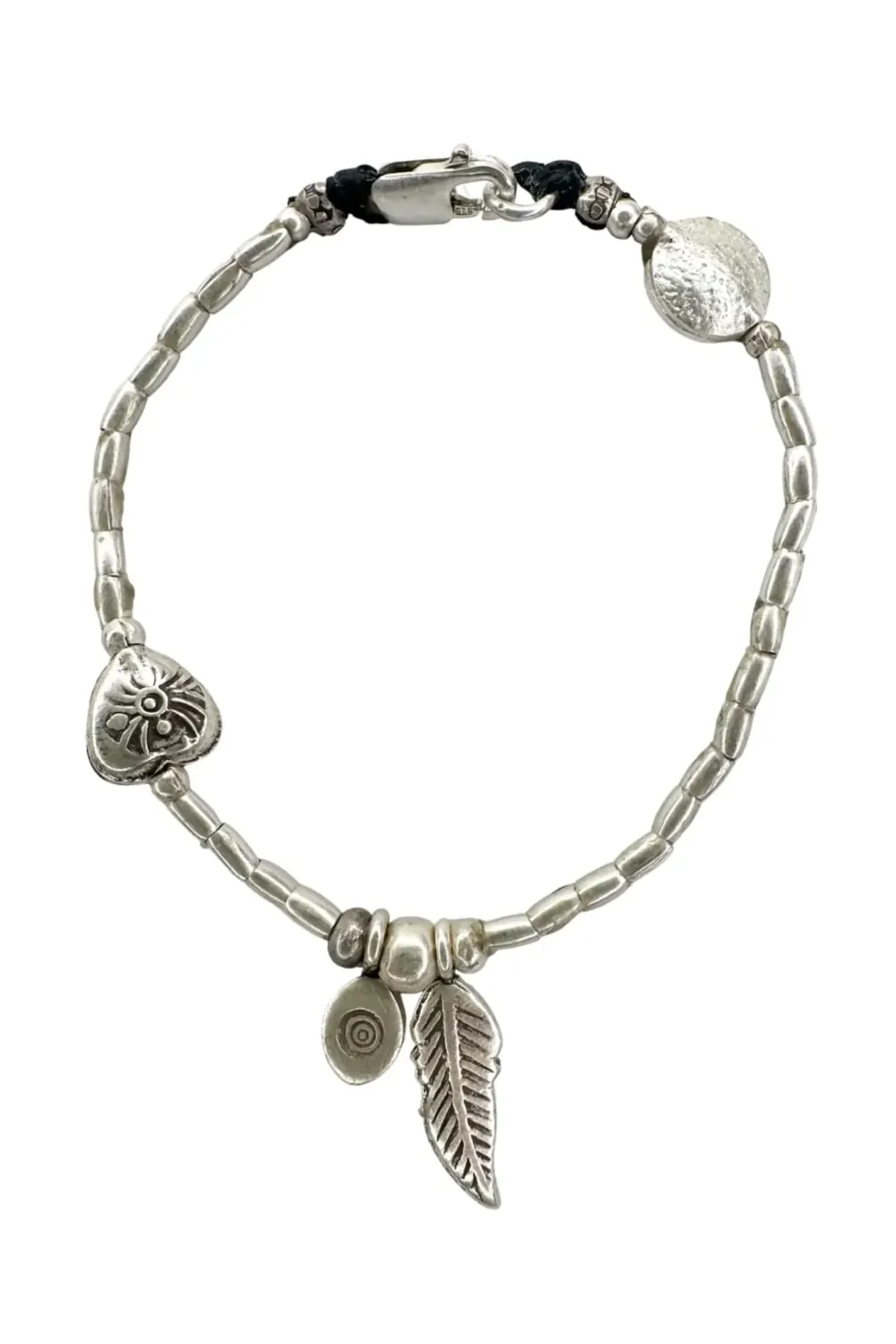 pure silver bracelet boho inspired. feather pendant perfect for everyday wear. ocean safe.