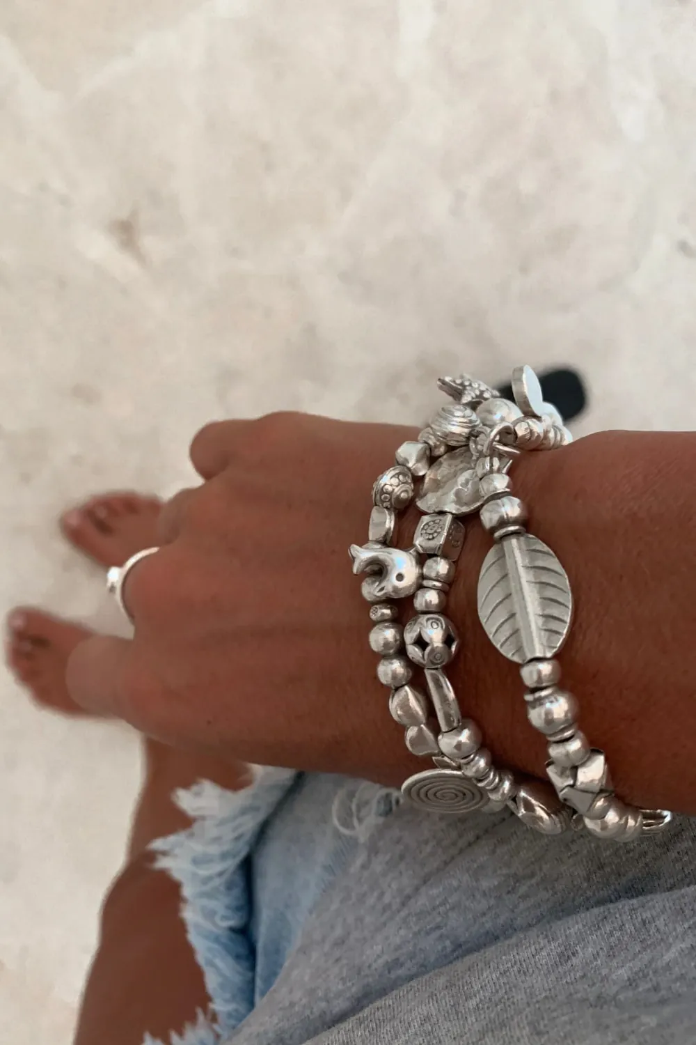 handmade pure silver bracelet. perfect for a bracelet stack. Stitch elastic so easy to slip on. ocean safe