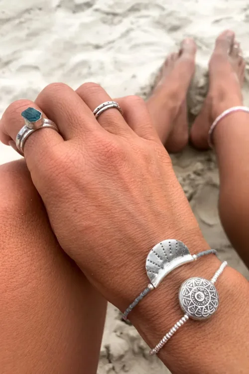 silver crescent disc with grey and pink seed bead. style this bracelet for a minimal look or a pop of colour to your bracelet stack