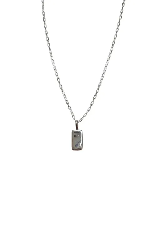 petite sterling silver rectangle pendant with moon detail on sterling silver curb chain. Dainty necklace. ocean safe