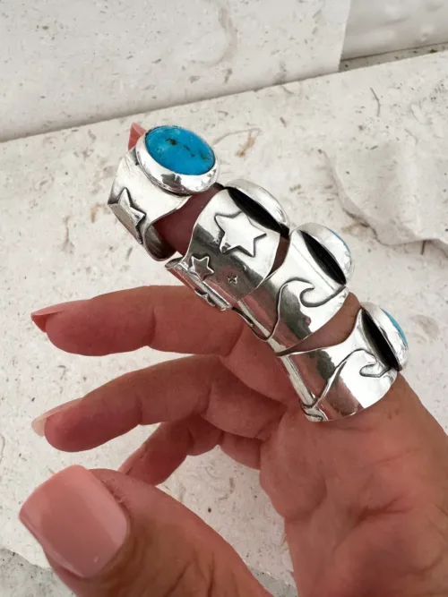 handmade chunky turquoise ring set in sterling silver with hand cut palm trees and waves ocean safe beach inspired