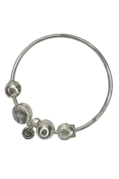 sterling silver bangle with pure silver ball beads and shell charm tassel. Handmade and ocean inspired. ocean safe and perfect to wear everyday