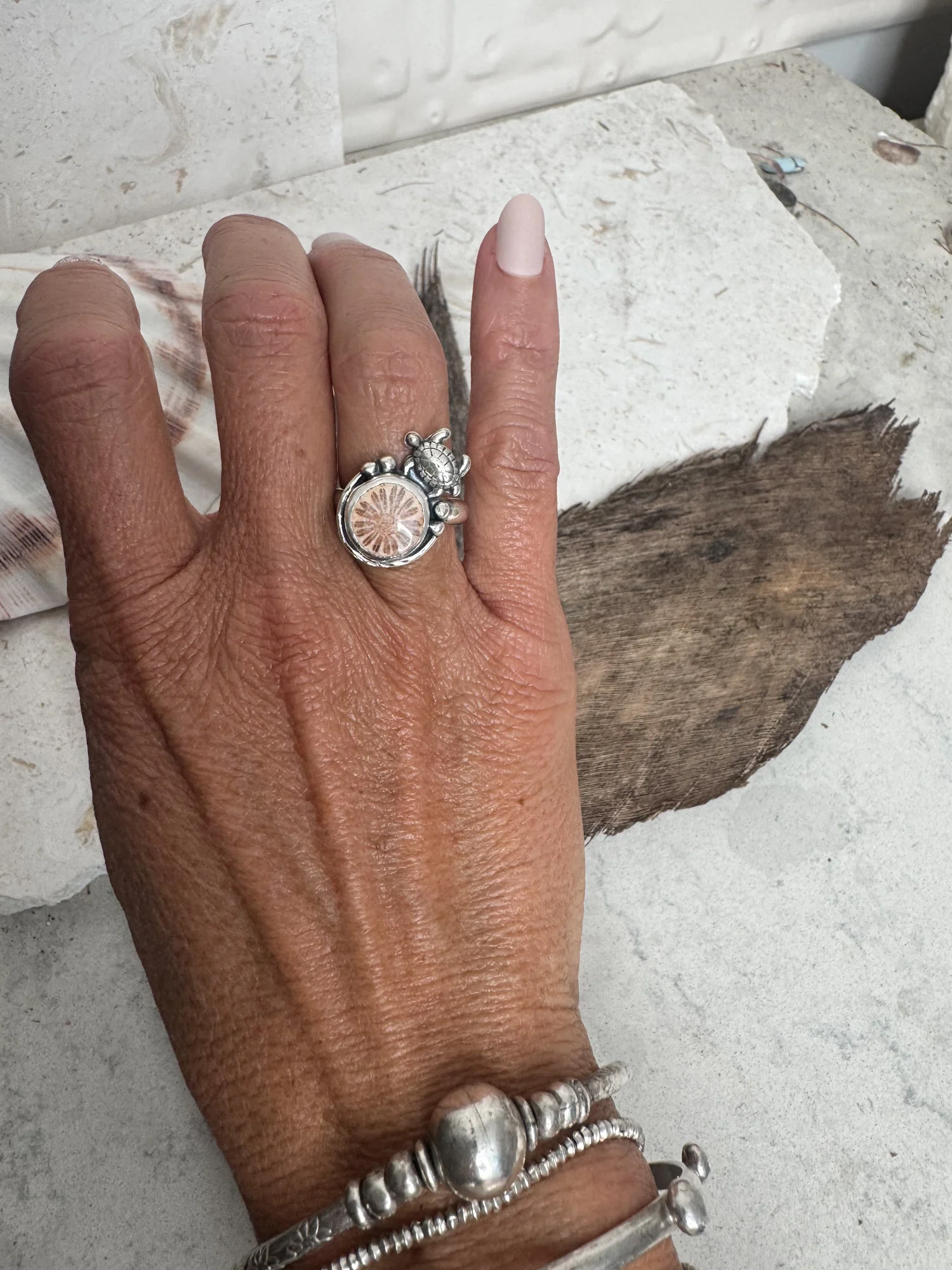 handmade sterling silver fossilised coral ring. inspired by the ocean. Unique jewellery