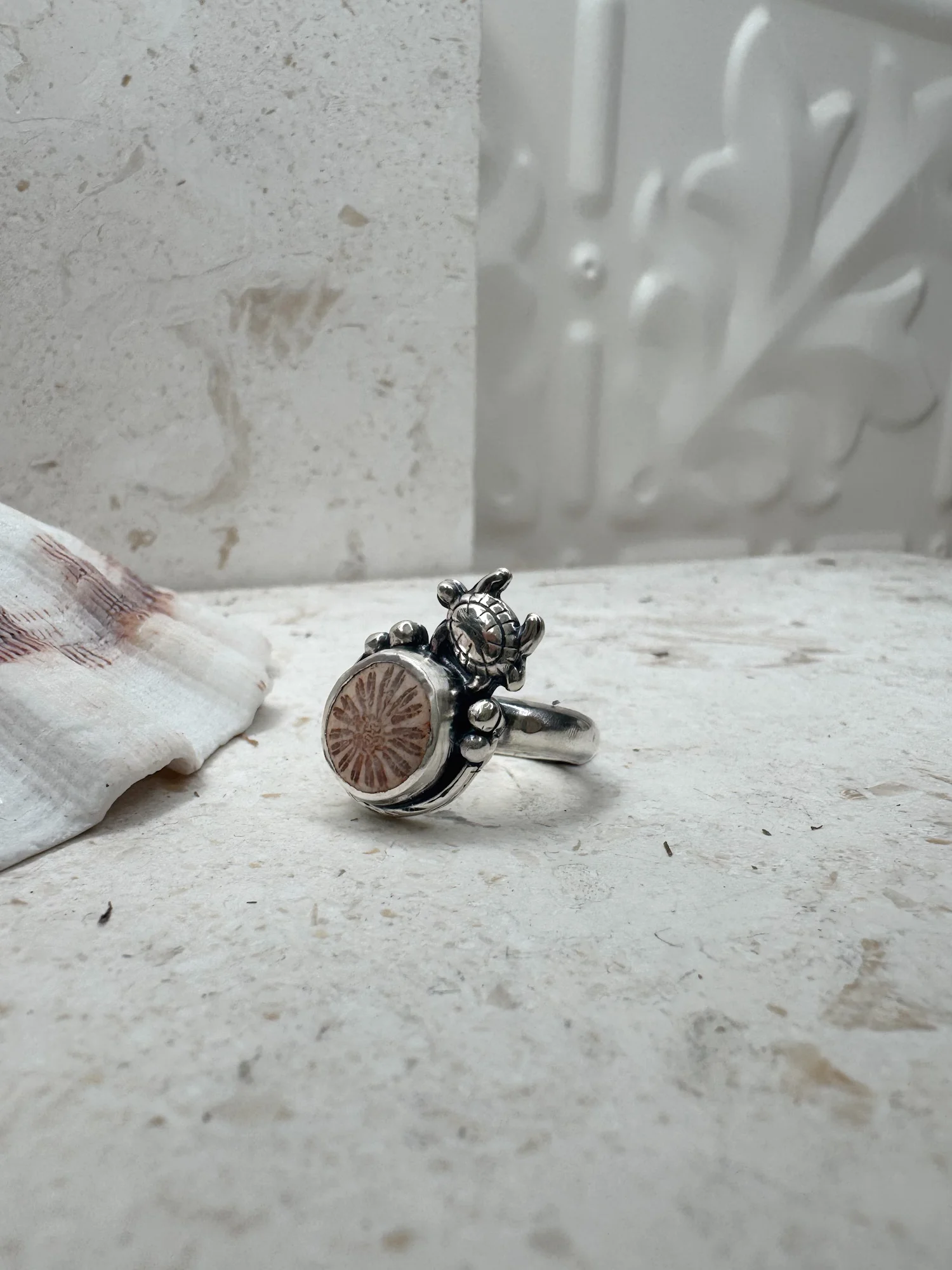 handmade sterling silver fossilised coral ring. inspired by the ocean. Unique jewellery