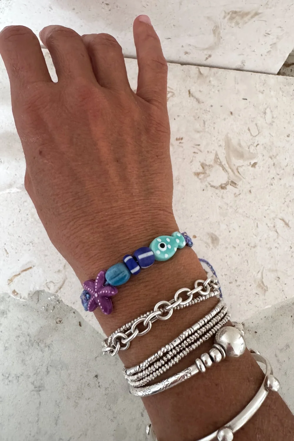 fish macrame bracelet adjustable colourful purple. perfect to add colour to a bracelet. stack this summer.