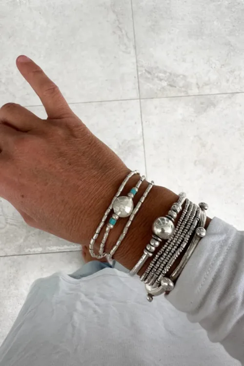ocean inspired silver jewellery. Pure silver wrap bracelet minimal everyday style for a beach vibes look- water safe for everyday wear. 3 styles in 1
