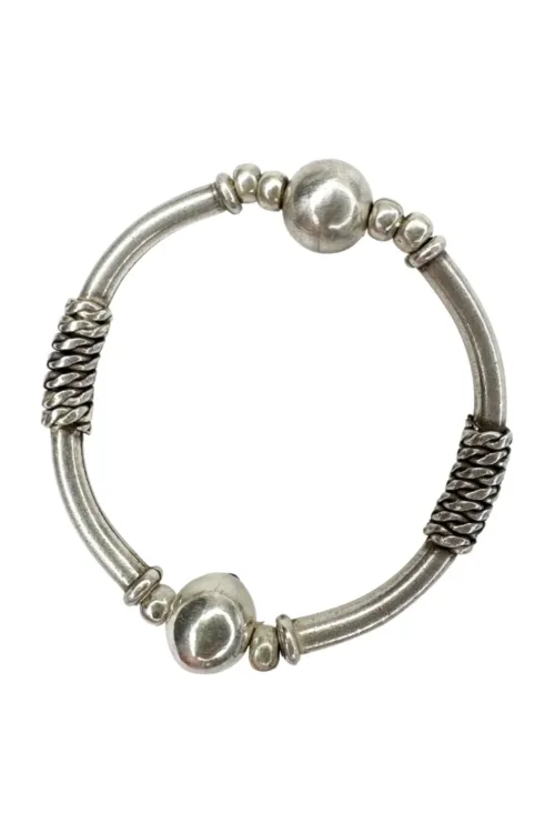 solid pure silver curve bar stretch bracelet. Easy to slip oxn and off. Ocean safe and strong. looks great in a bracelet stack