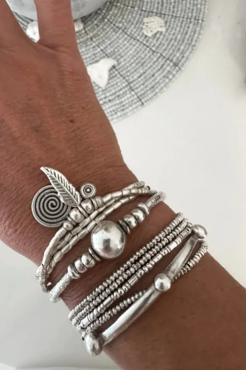 bohemian style silver jewellery. Pure silver wrap bracelet with silver spiral char, feather charm and eye protection charm - for a boho beach chic look- water safe for everyday wear. 3 styles in 1