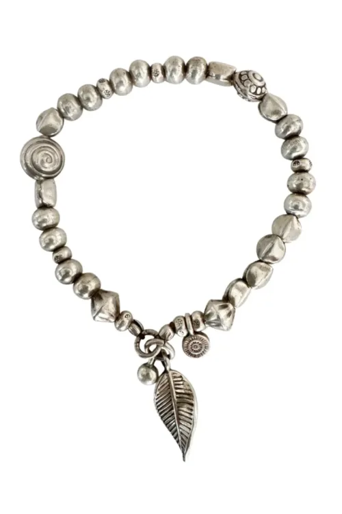 handmade pure silver bracelet. perfect for a bracelet stack. Stitch elastic so easy to slip on. ocean safe