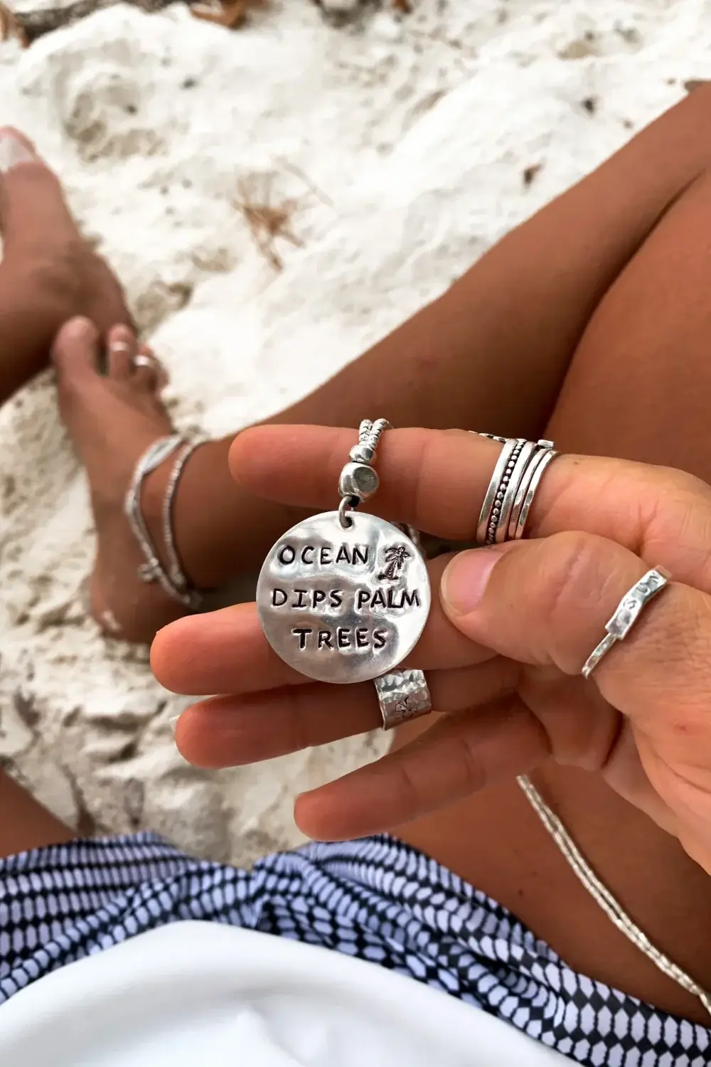 ocean inspired large handmade sterling silver disc pendant on long pure silver chain necklace. 'ocean dips, palms trees' hand stamped onto the silver disc. ocean safe island girl jewellery