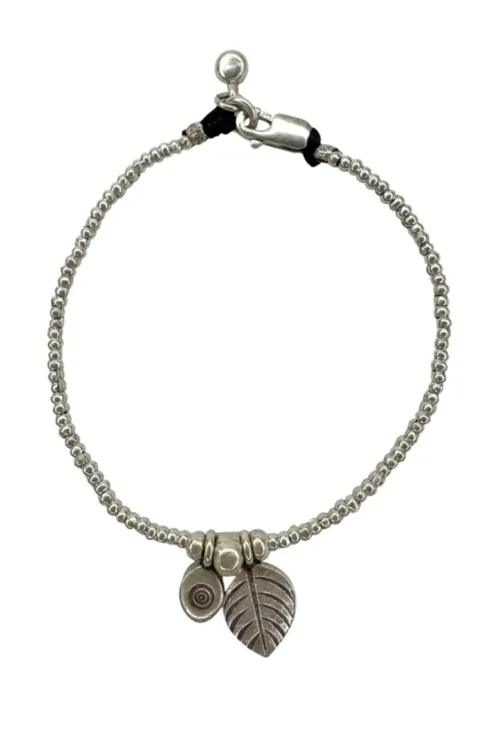 pure silver bracelet with leaf and evil eye pendant. tug proof - perfect for active mums. ocean safe