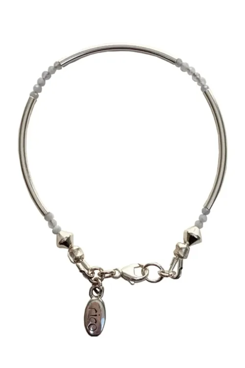 sterling silver curve bar bracelet with small faceted gemstones. wear solo or stacked up.