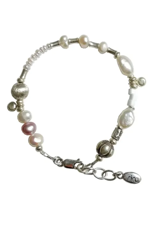 freshwater pearl silver bracelet with lots of charms.