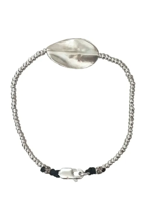 pure silver bracelet with warped disc. tug proof - perfect for active mums. ocean safe